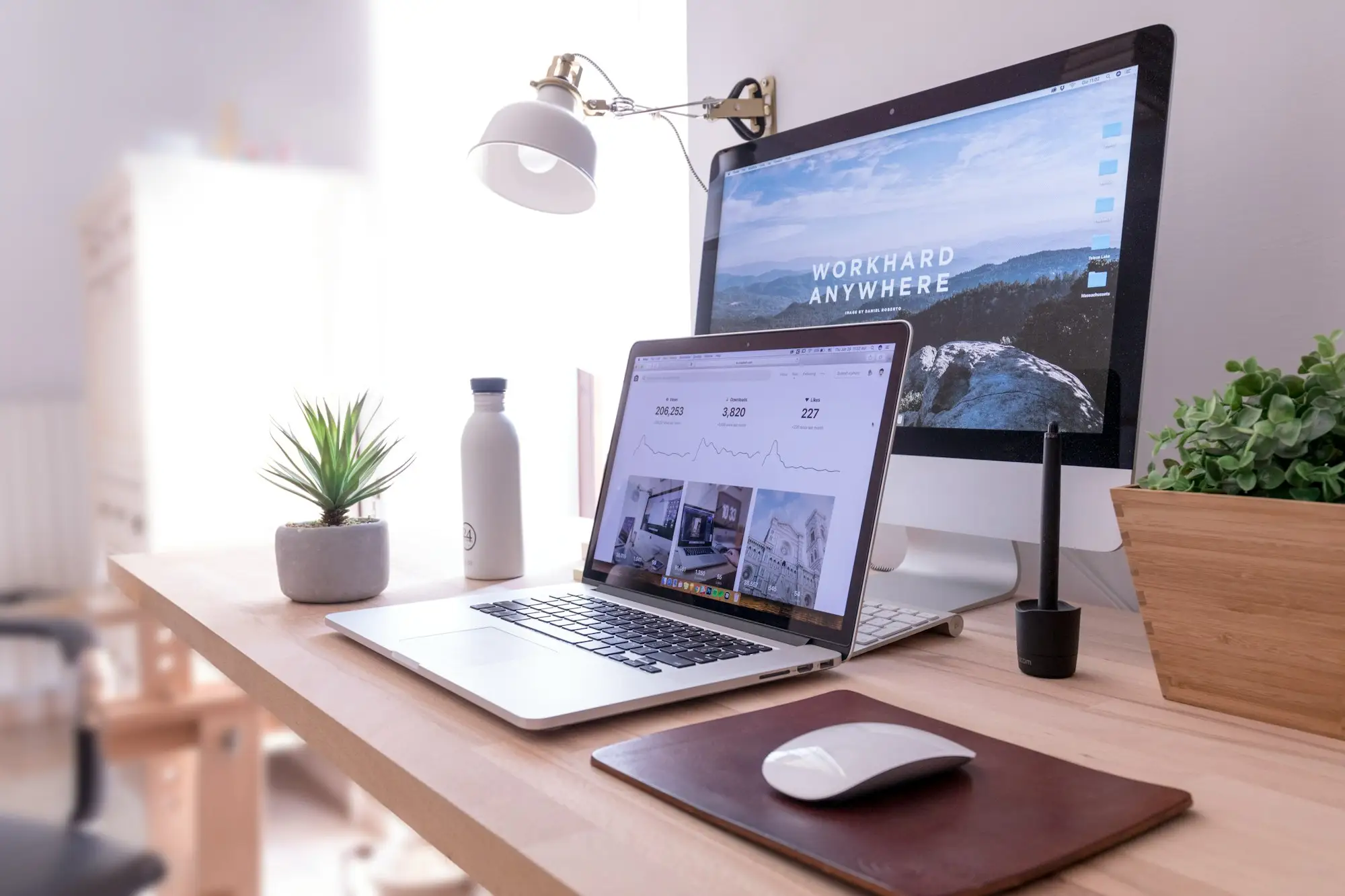 Bright workspace with a monitor and finished website