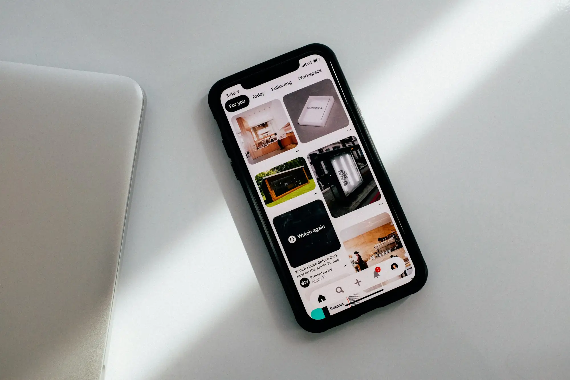 Smartphone showing a mobile website on a light background